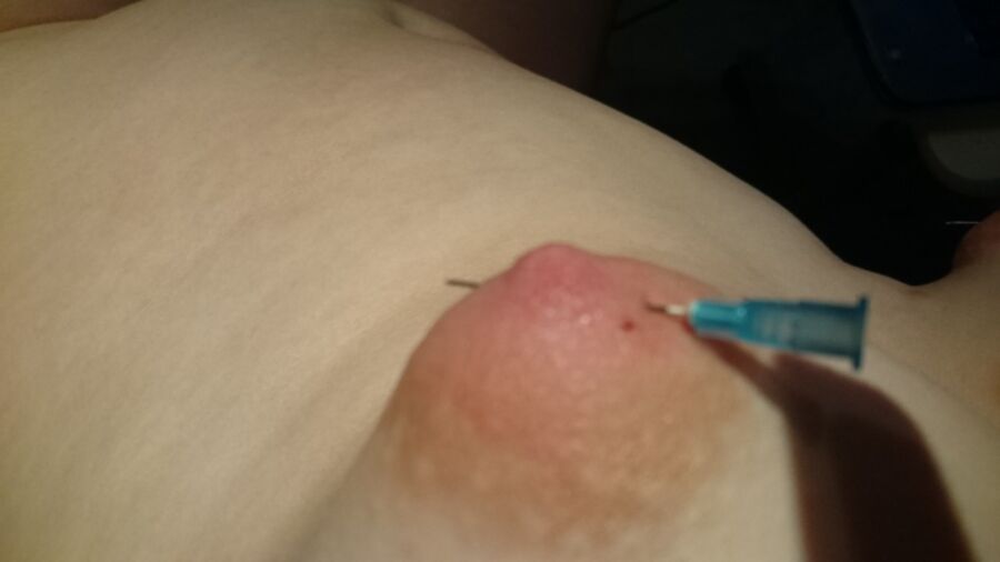 Free porn pics of Piercing my puffy nipples with needles 5 of 12 pics