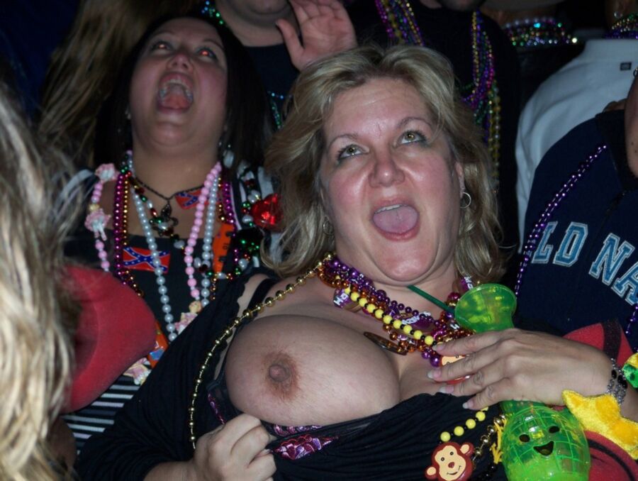 Free porn pics of Flashing Moms: Mardi Gras Tits 4 of 30 pics