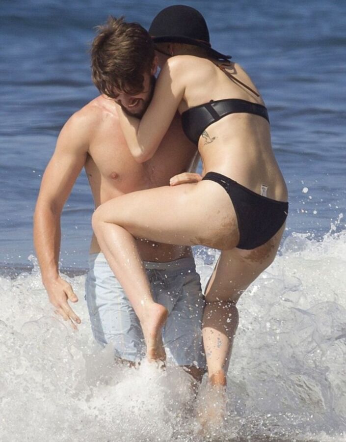 Free porn pics of Miley Cyrus Topless on Hawaii 2 of 44 pics