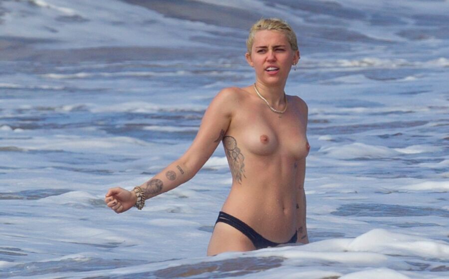Free porn pics of Miley Cyrus Topless on Hawaii 22 of 44 pics