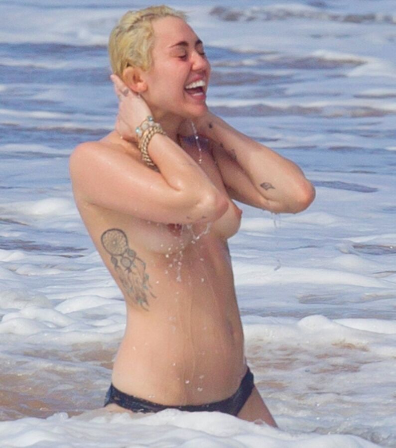 Free porn pics of Miley Cyrus Topless on Hawaii 10 of 44 pics