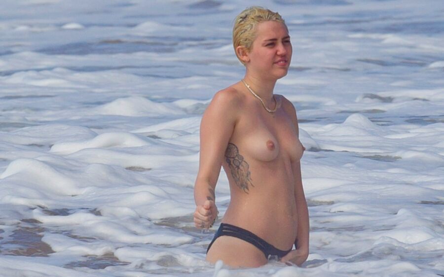 Free porn pics of Miley Cyrus Topless on Hawaii 21 of 44 pics