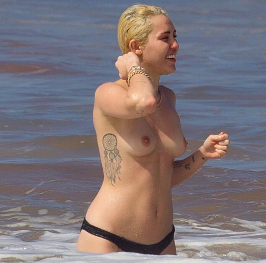 Free porn pics of Miley Cyrus Topless on Hawaii 15 of 44 pics