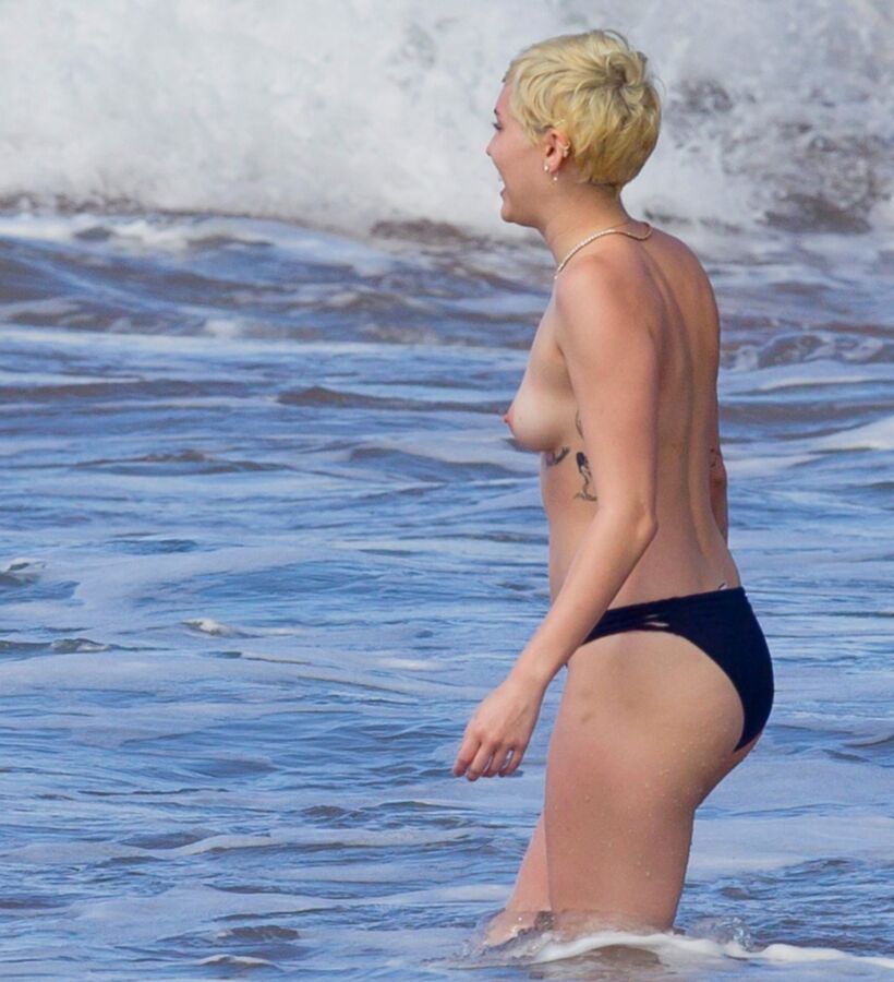 Free porn pics of Miley Cyrus Topless on Hawaii 7 of 44 pics