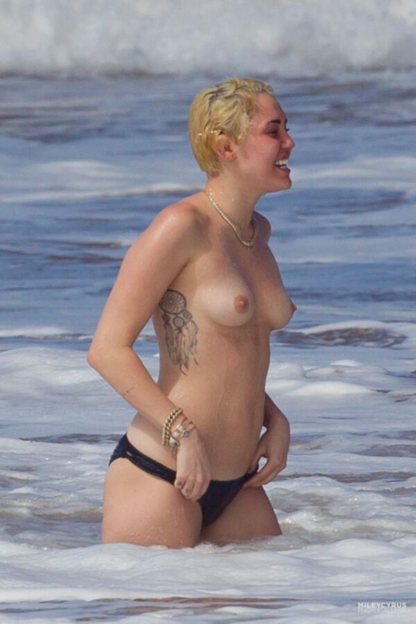 Free porn pics of  Miley Cyrus topless 1 of 10 pics