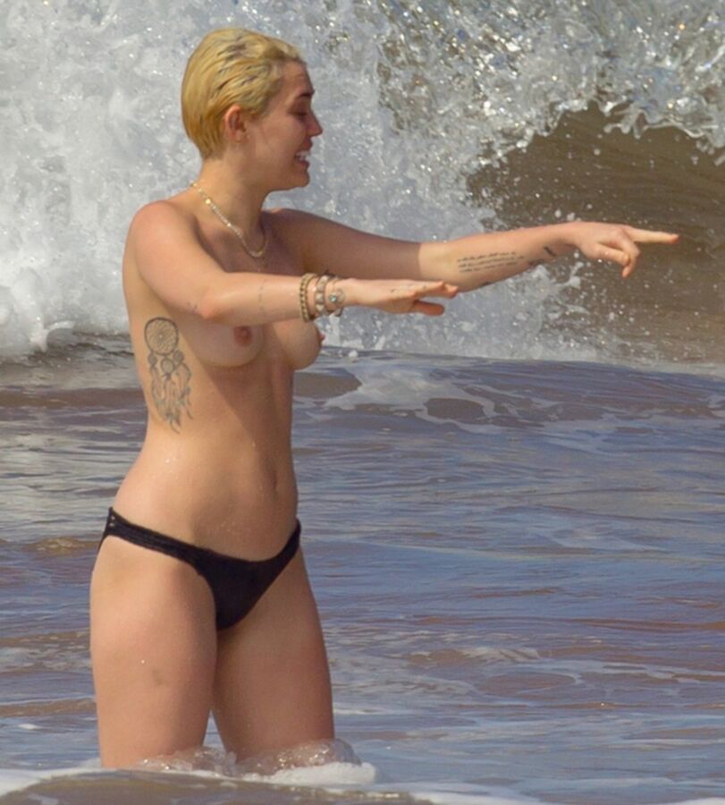 Free porn pics of Miley Cyrus Topless on Hawaii 16 of 44 pics