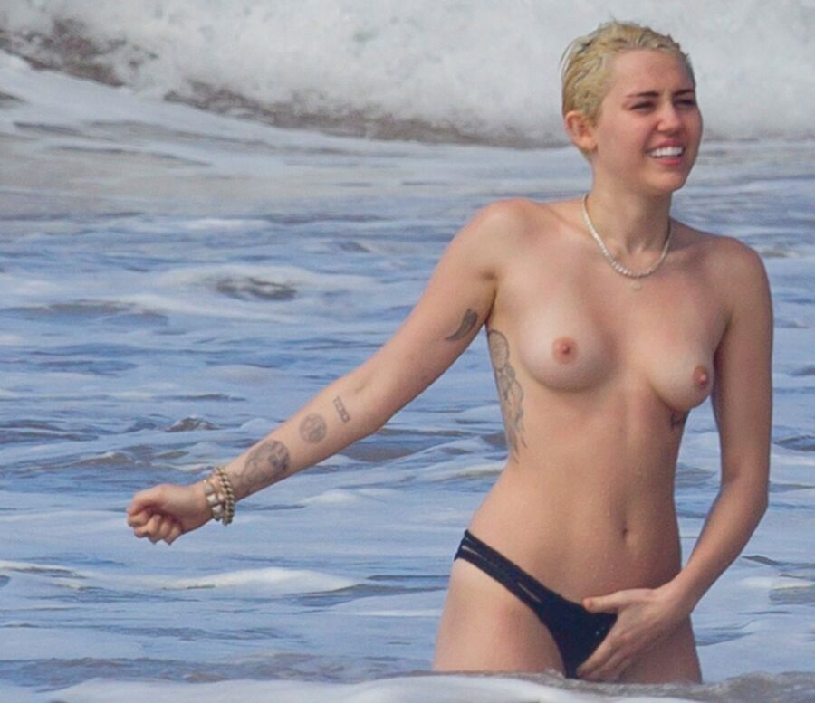 Free porn pics of Miley Cyrus Topless on Hawaii 24 of 44 pics