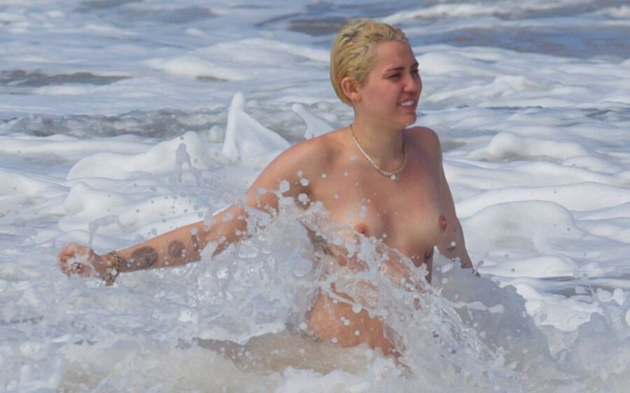 Free porn pics of Miley Cyrus Topless on Hawaii 20 of 44 pics