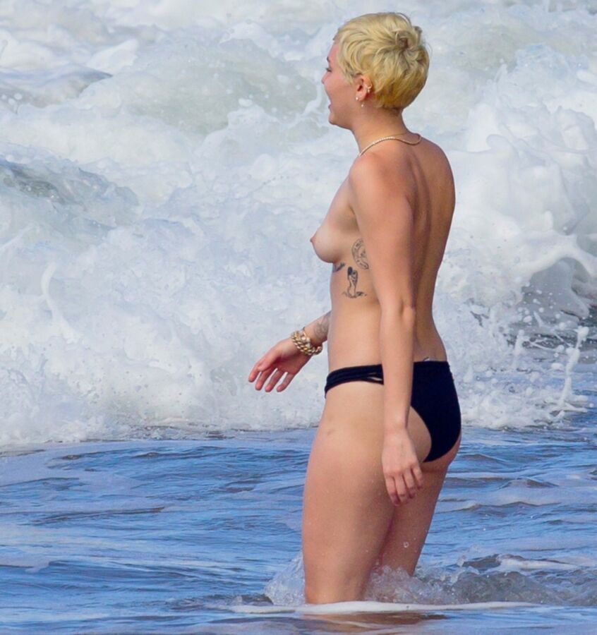 Free porn pics of Miley Cyrus Topless on Hawaii 8 of 44 pics