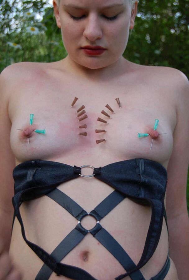Free porn pics of Needles and nails in women´s breasts 13 of 18 pics
