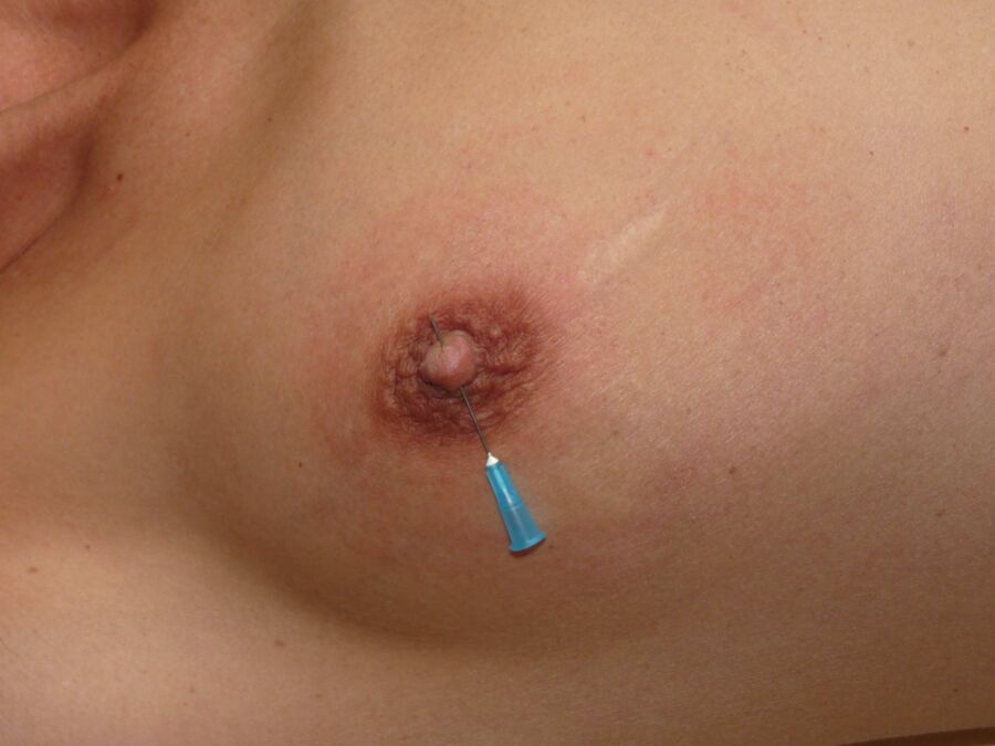 Free porn pics of Needles and nails in women´s breasts 11 of 18 pics