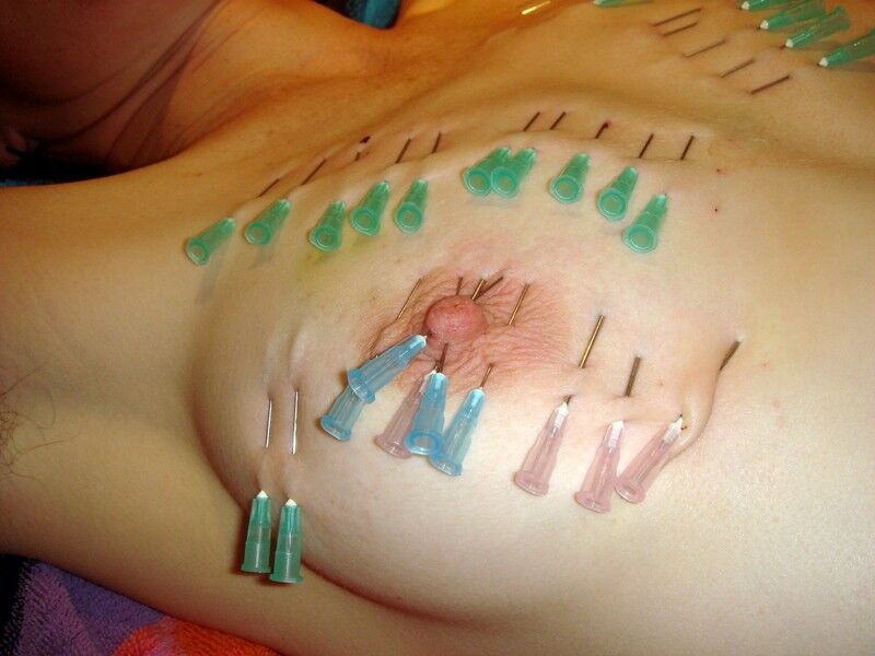 Free porn pics of Needles and nails in women´s breasts 16 of 18 pics