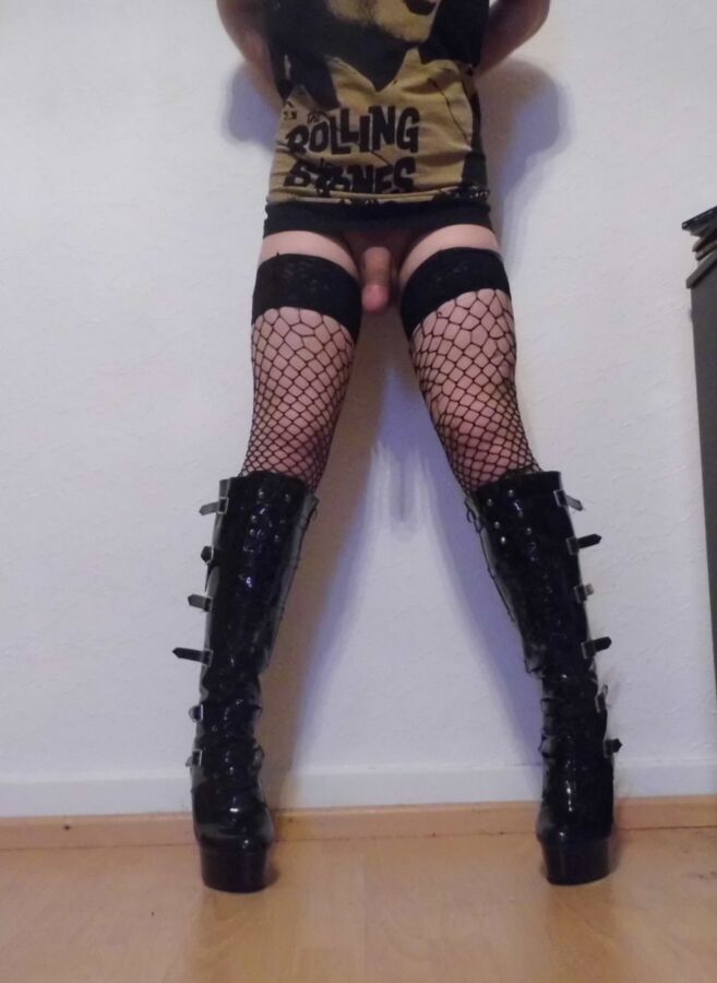 Free porn pics of Crossdressing Boots And Torn Fishnet Stockings 6 of 9 pics