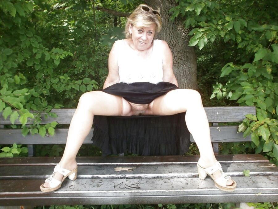 Free porn pics of Hairy blonde granny strips in the park 13 of 15 pics