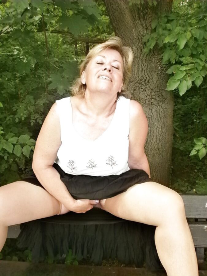 Free porn pics of Hairy blonde granny strips in the park 6 of 15 pics