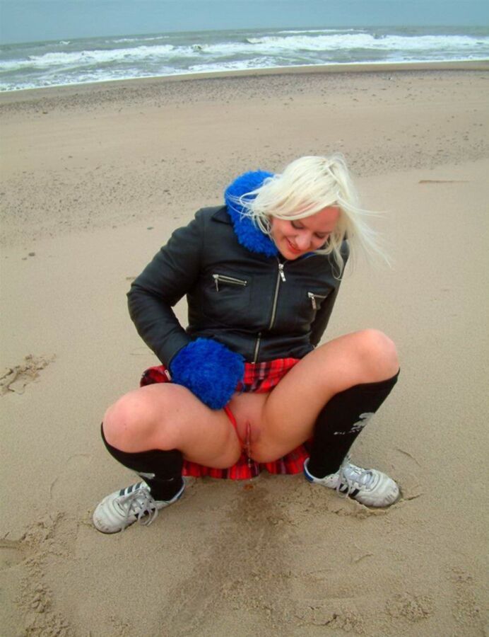 Free porn pics of Public pissing on the beach 13 of 16 pics