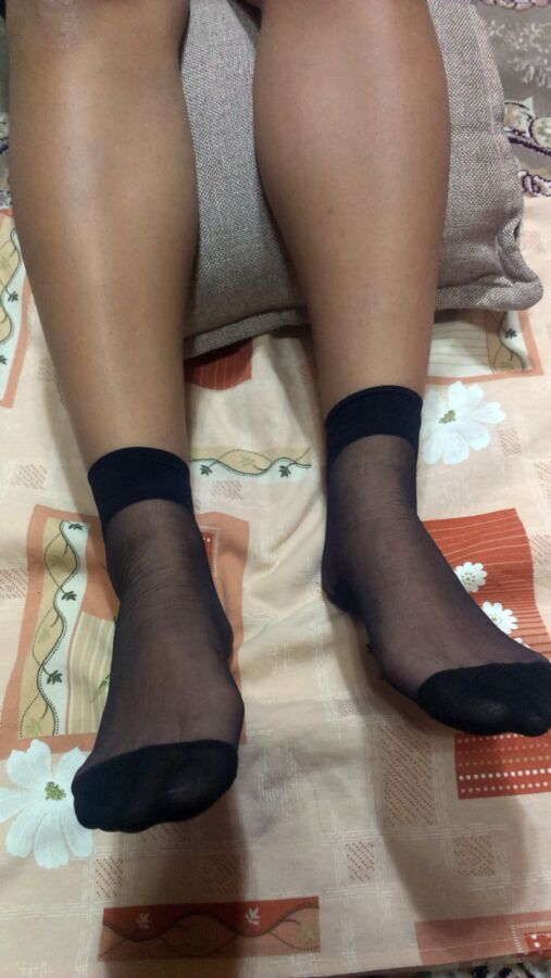 Free porn pics of persian chick give footjob in black nylon socks 23 of 50 pics