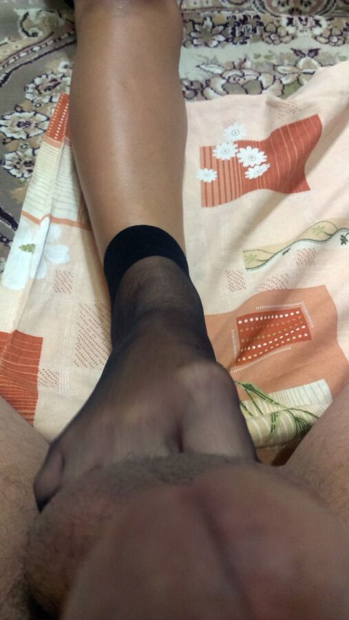 Free porn pics of persian chick give footjob in black nylon socks 16 of 50 pics