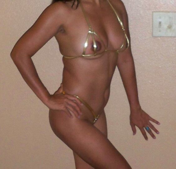 Free porn pics of Swollen pussy in extreme gold bikini 2 of 18 pics