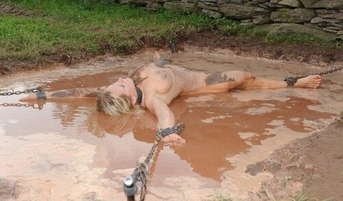 Free porn pics of Outdoor bondage in mud 4 of 17 pics