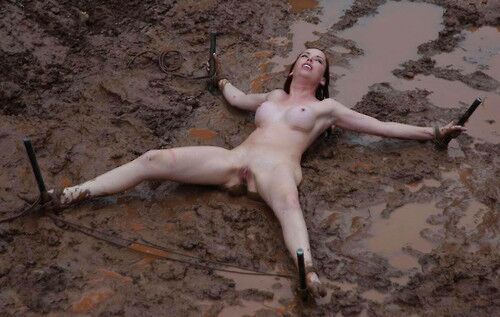 Free porn pics of Outdoor bondage in mud 2 of 17 pics